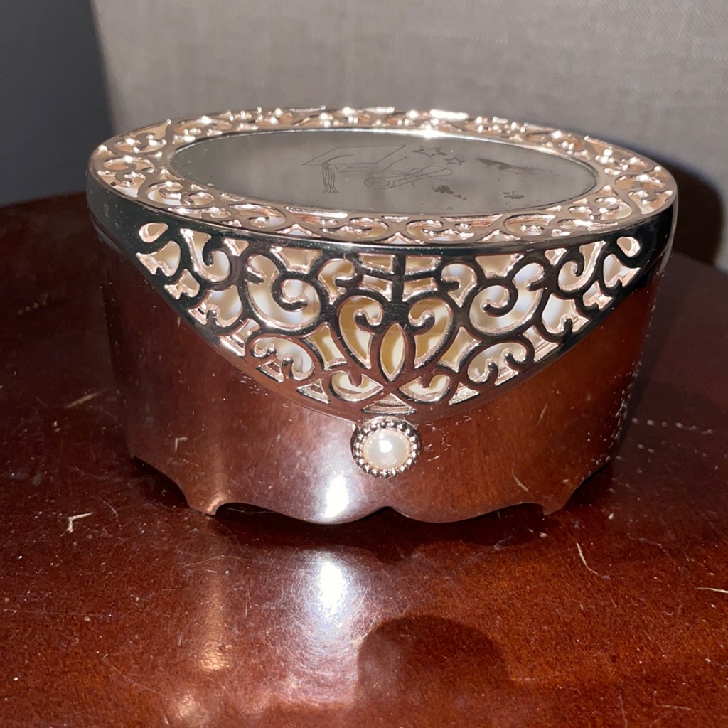 Gently Used Silver Jewelry Keepsake Box. Diploma And Hat On Top Of Box.